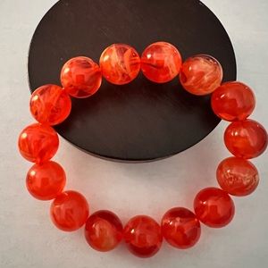 Bright orange beaded elastic adjustable bracelet